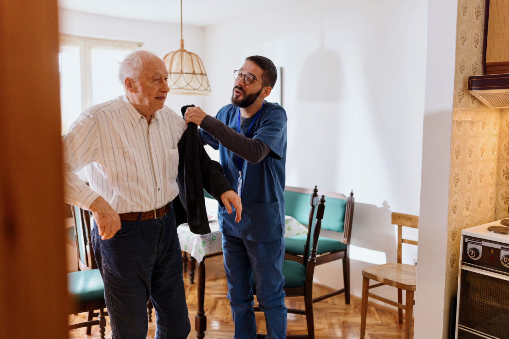 Home caretaker – man helping senior man